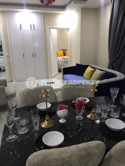 Две квартиры 1+1 на разных этажах в новом доме района Махмутлар-id-8435-фото-3