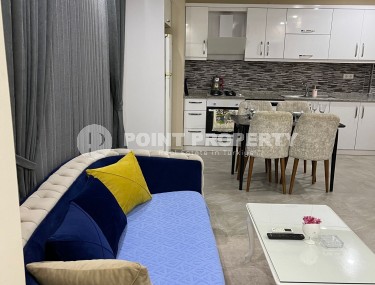 Две квартиры 1+1 на разных этажах в новом доме района Махмутлар-id-8435-фото-4