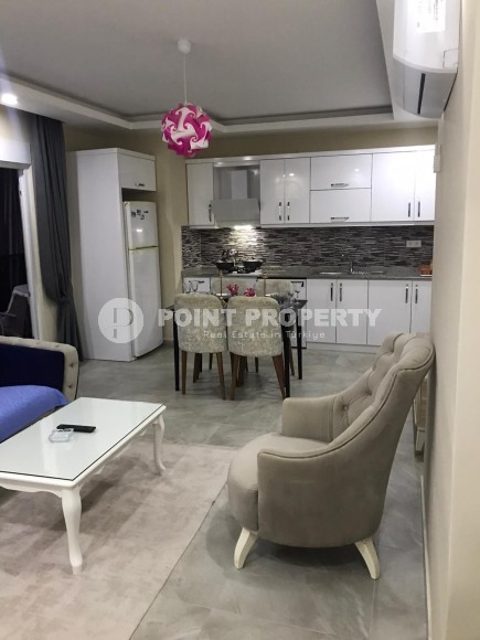 Две квартиры 1+1 на разных этажах в новом доме района Махмутлар-id-8435-фото-5