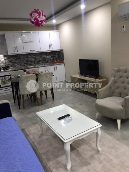 Две квартиры 1+1 на разных этажах в новом доме района Махмутлар-id-8435-фото-7