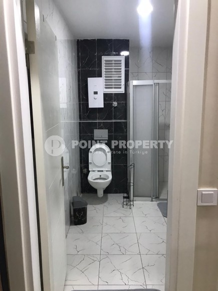 Две квартиры 1+1 на разных этажах в новом доме района Махмутлар-id-8435-фото-13