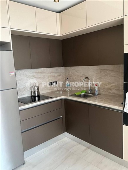 Квартира 1+1 в одном из лучших комплексов Махмутлара-id-8452-фото-2