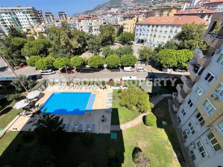 Квартира 1+1 в центре Алании с открытым видам на горы-id-8472-фото-11