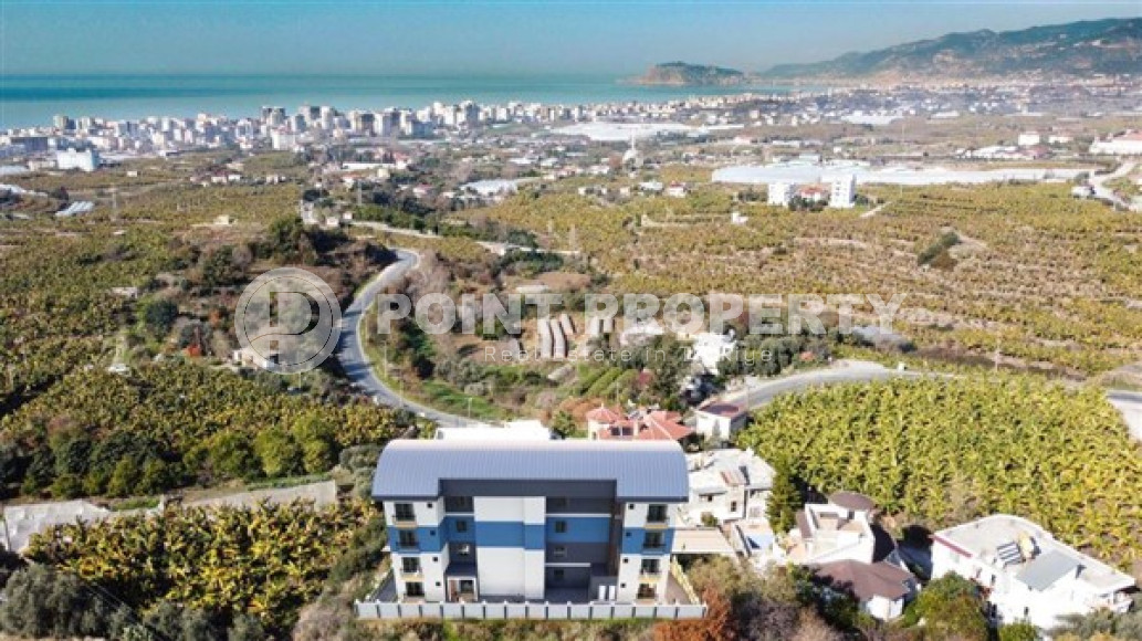 One bedroom apartment, 51m² in a residence under construction, at the foot of the mountains in Mahmutlar, Alanya-id-1665-photo-3