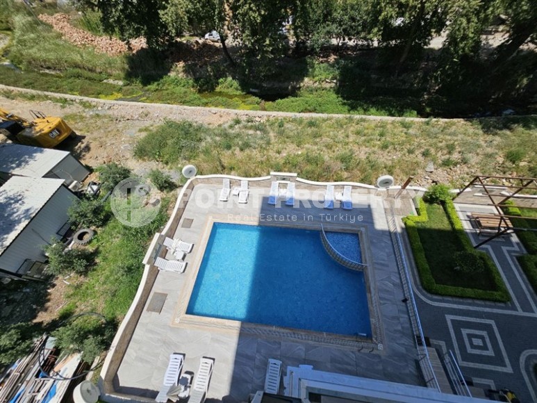 Стильная квартира 55 м² в ухоженном комплексе в Махмутларе-id-8514-фото-14