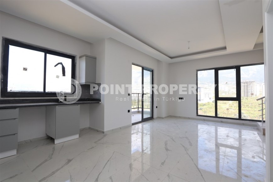 Современный дуплекс 100 м² с двумя спальнями и живописным видом в Махмутларе-id-8574-фото-3