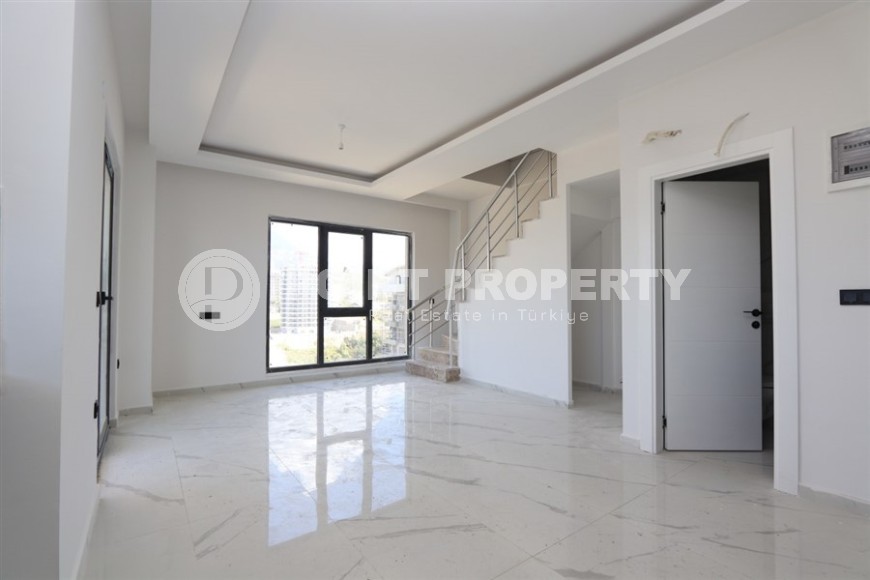 Современный дуплекс 100 м² с двумя спальнями и живописным видом в Махмутларе-id-8574-фото-4