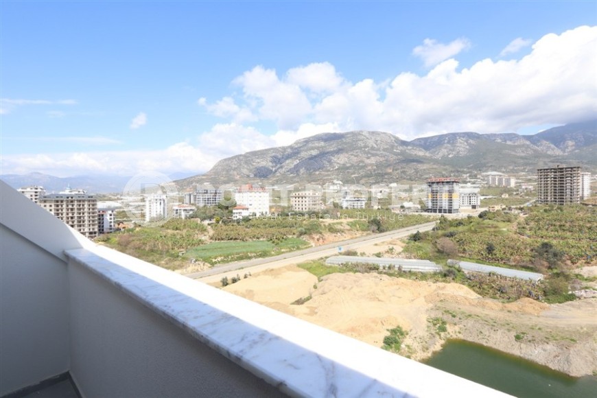 Современный дуплекс 100 м² с двумя спальнями и живописным видом в Махмутларе-id-8574-фото-13