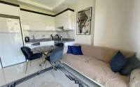 Меблированные апартаменты 50 м² в новом комплексе с хорошей инфраструктурой в Махмутларе-id-8577-photo-2