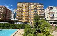 Large two bedroom apartment, 125m², in a cozy complex with a swimming pool, by the sea in Mahmutlar, Alanya-id-1675-photo-1