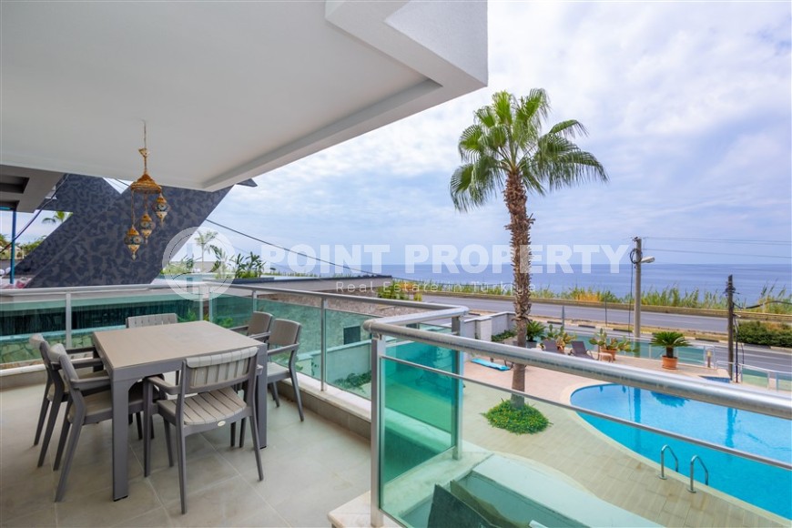 Furnished apartment 110 m² on the beach with panoramic sea view in Kargicak-id-8705-photo-2