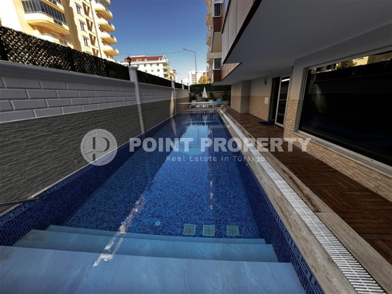 Просторная квартира 65 м² с застекленным балконом в Махмутларе, рядом с морем-id-8767-фото-12