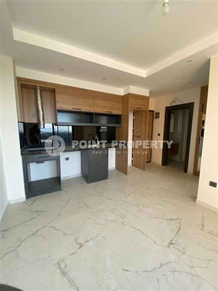 Современная квартира 50 м² в новом комплексе в Махмутларе-id-8795-фото-2