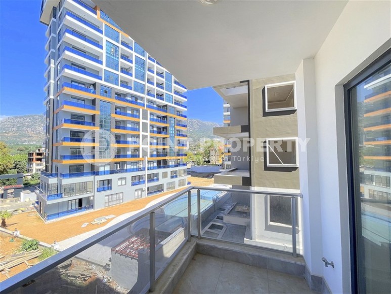 Современная квартира 55 м² в новом комплексе в Махмутларе-id-8838-фото-9