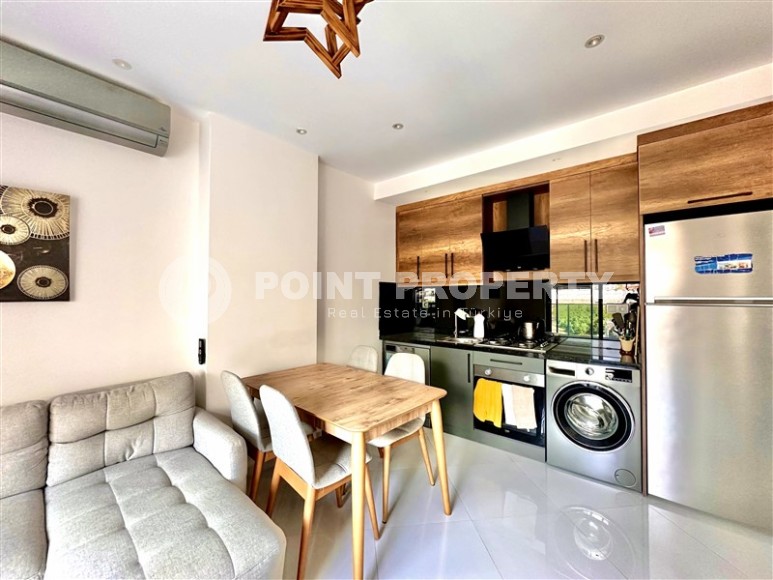 Просторная 1+1 квартира 55 м² с современной инфраструктурой в центре Махмутлара-id-8853-фото-2