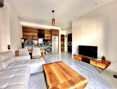 Просторная 1+1 квартира 55 м² с современной инфраструктурой в центре Махмутлара-id-8853-фото-3