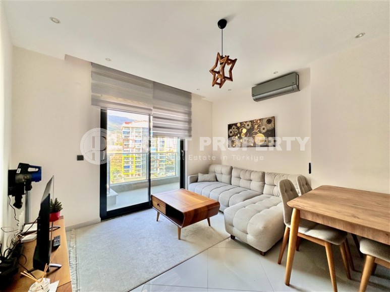 Просторная 1+1 квартира 55 м² с современной инфраструктурой в центре Махмутлара-id-8853-фото-4