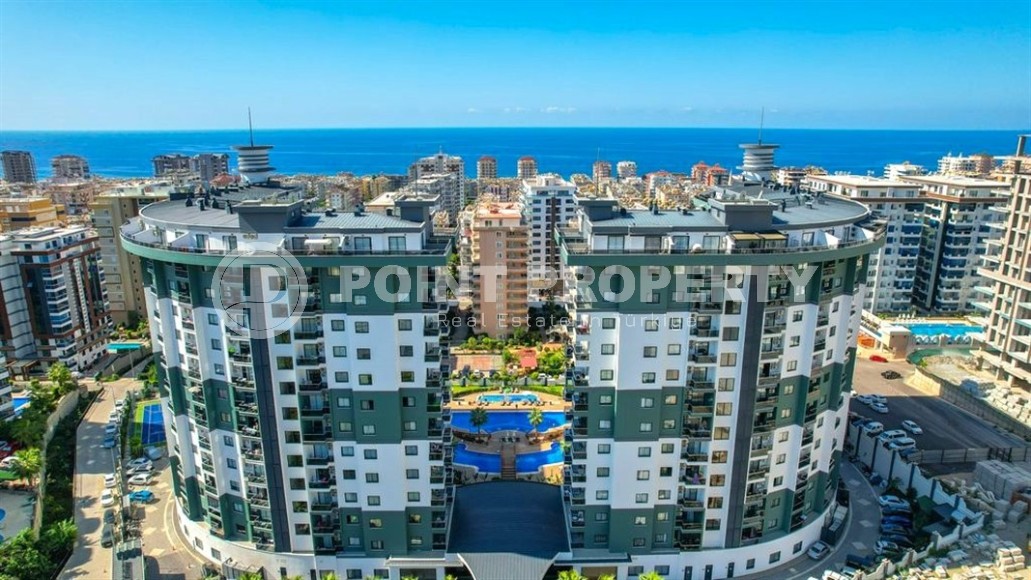 Просторная 1+1 квартира 55 м² с современной инфраструктурой в центре Махмутлара-id-8853-фото-17