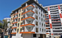 New one bedroom apartment, 55m². in a complex under construction in Mahmutlar area, Alanya-id-1694-photo-1