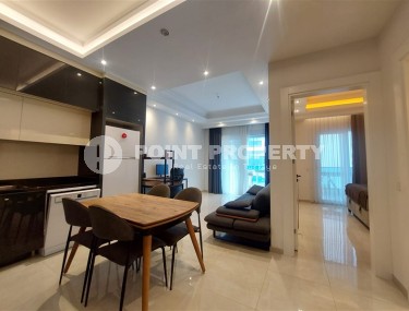 Стильная квартира 56 м² в престижном комплексе в центре Махмутлара-id-8909-фото-2