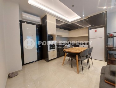 Стильная квартира 56 м² в престижном комплексе в центре Махмутлара-id-8909-фото-3