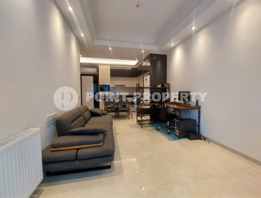 Стильная квартира 56 м² в престижном комплексе в центре Махмутлара-id-8909-фото-4