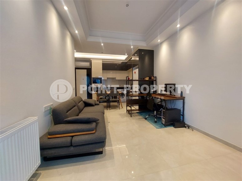 Стильная квартира 56 м² в престижном комплексе в центре Махмутлара-id-8909-фото-4