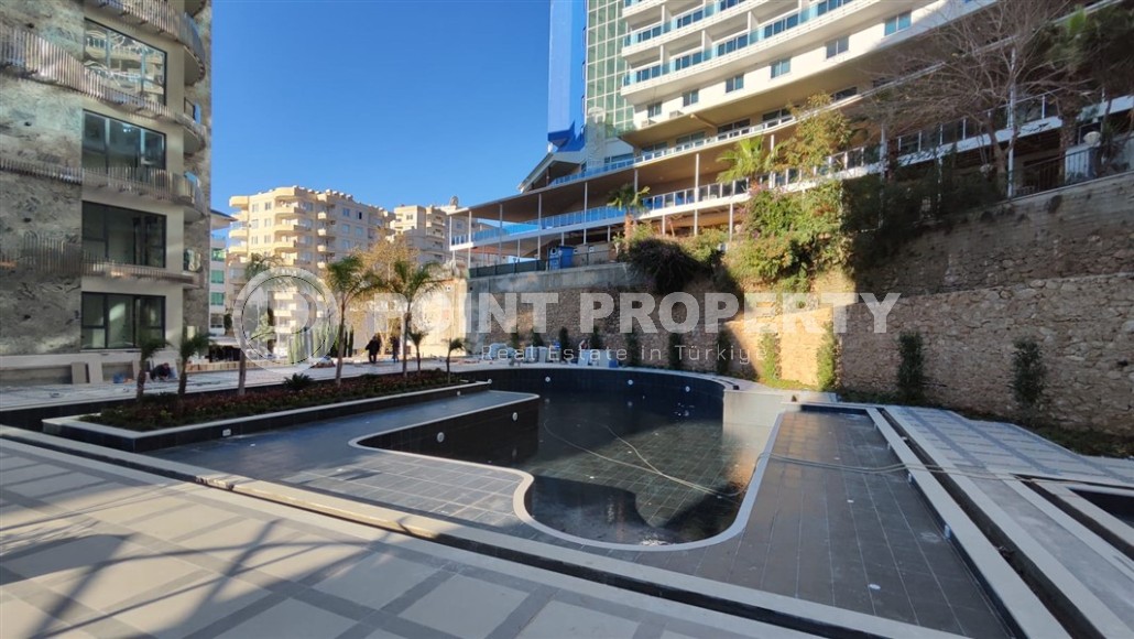 Квартиры в строящемся жилом комплексе премиум класса, в центре живописного, экологически чистого района Аланьи - Тосмур-id-7283-фото-7