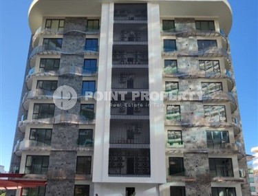 New two-room apartment 55 m2 in a residence under construction consisting of three buildings, Tosmur district-id-3974-photo-1