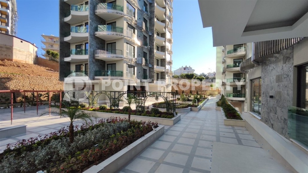 New two-room apartment 55 m2 in a residence under construction consisting of three buildings, Tosmur district-id-3974-photo-11