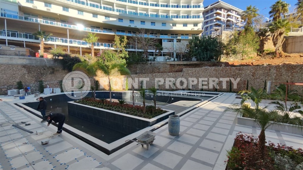 New two-room apartment 55 m2 in a residence under construction consisting of three buildings, Tosmur district-id-3974-photo-12