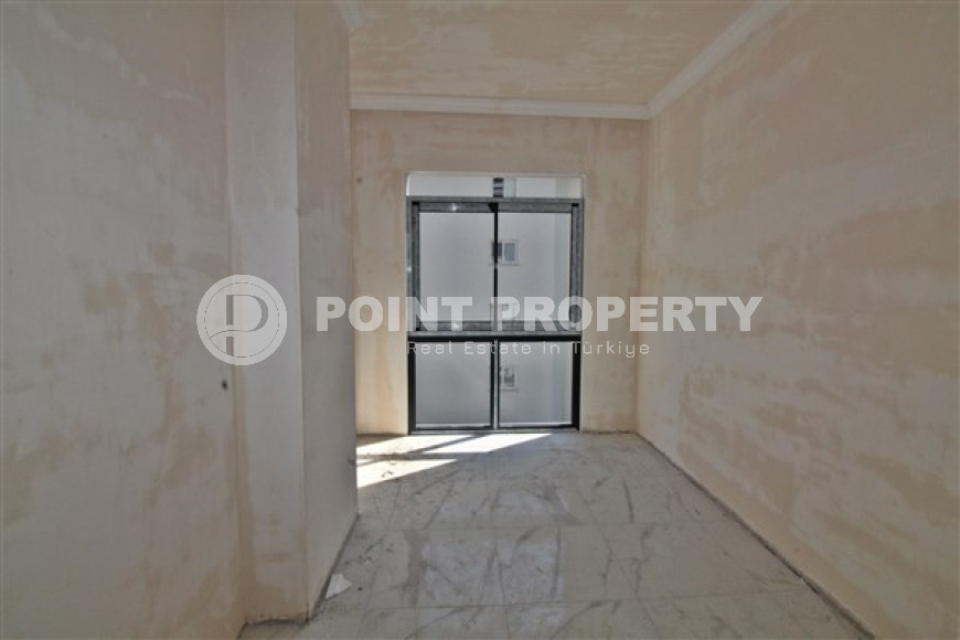 New one bedroom apartment, 55m². in a complex under construction in Mahmutlar area, Alanya-id-1694-photo-12