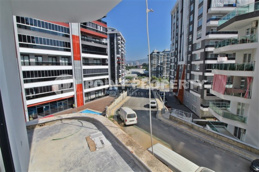 New one bedroom apartment, 55m². in a complex under construction in Mahmutlar area, Alanya-id-1694-photo-16
