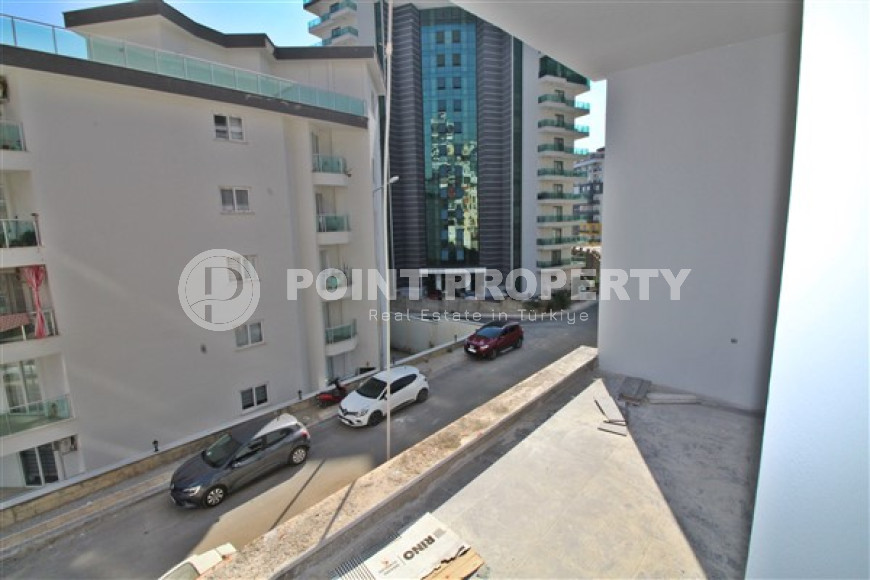 New one bedroom apartment, 55m². in a complex under construction in Mahmutlar area, Alanya-id-1694-photo-18