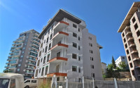 New one bedroom apartment, 55m². in a complex under construction in Mahmutlar area, Alanya-id-1694-photo-26