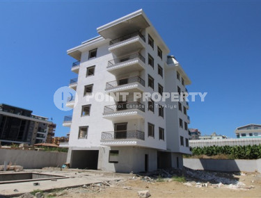 One-bedroom apartment, 75m², in a complex in the final stage of construction by the sea, in Kargicak, Alanya-id-1700-photo-1