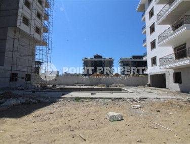 Двухкомнатная квартира, 75м², в комплексе на окончательном этапе строительства у моря, в Каргыджаке, Алания-id-1700-фото-3