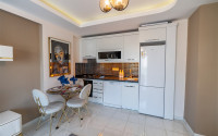 Furnished 1+1 apartment in a complex with an excellent location in the Mahmutlar area, 55 m2.-id-1109-photo-3