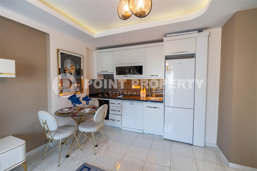 Furnished 1+1 apartment in a complex with an excellent location in the Mahmutlar area, 55 m2.-id-1109-photo-3
