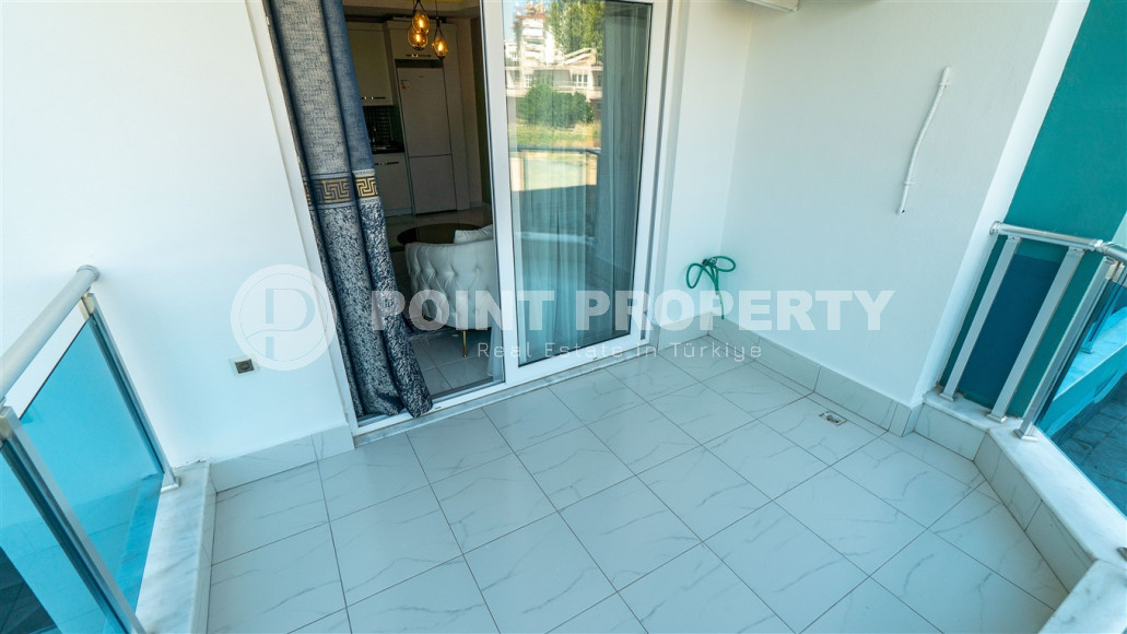 Furnished 1+1 apartment in a complex with an excellent location in the Mahmutlar area, 55 m2.-id-1109-photo-12