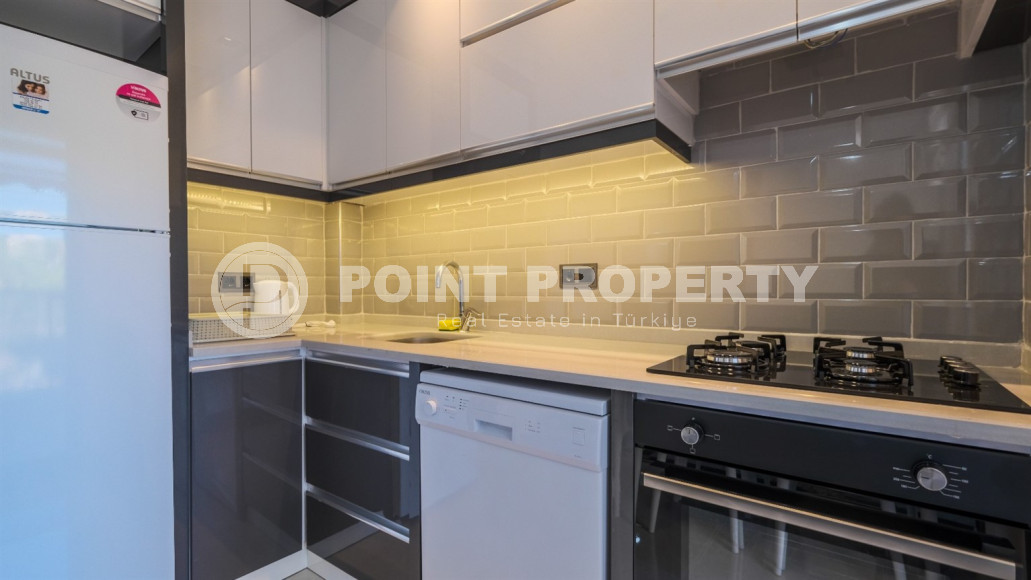 Двухкомнатная квартира в одном из развитых районов Алании в Махмутлар. Планировка 1+1, 350 метров до моря.-id-1112-фото-2