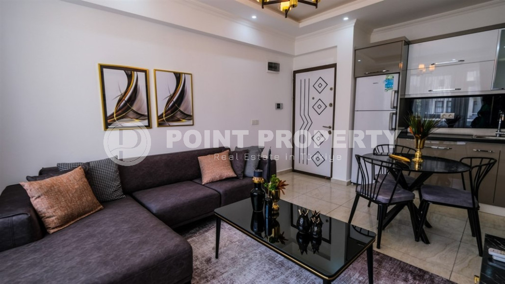 Уютные меблированные апартаменты планировкой 1+1, 55 м2, в самом центре Аланьи в районе самого известного пляжа Клеопатры.-id-1113-фото-2