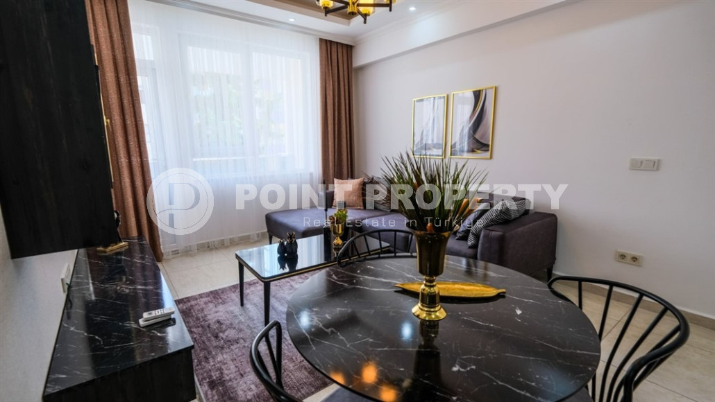 Уютные меблированные апартаменты планировкой 1+1, 55 м2, в самом центре Аланьи в районе самого известного пляжа Клеопатры.-id-1113-фото-9