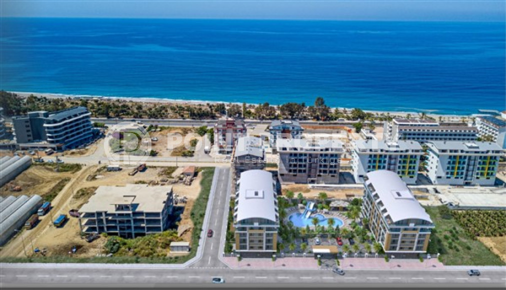 Двухкомнатная квартира, 55м², в комплексе на этапе строительства у моря в Каргыджаке, Алания-id-1829-фото-2