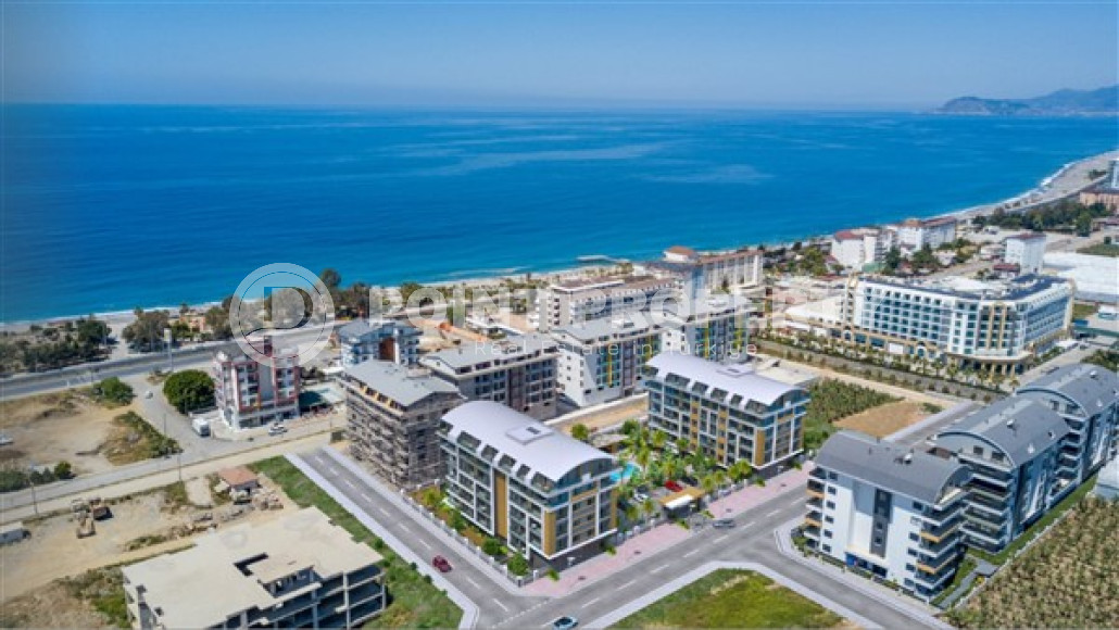 Двухкомнатная квартира, 55м², в комплексе на этапе строительства у моря в Каргыджаке, Алания-id-1829-фото-3