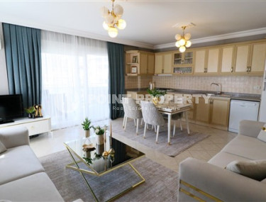 Furnished three-room apartment, 110m², on the main street of Mahmutlar with sea and mountain views-id-1835-photo-2