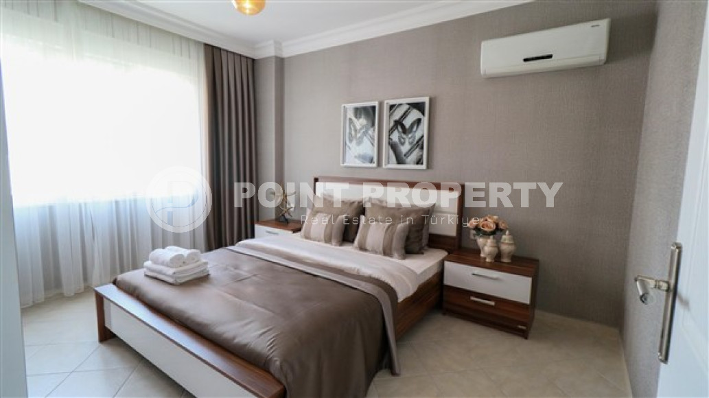 Furnished three-room apartment, 110m², on the main street of Mahmutlar with sea and mountain views-id-1835-photo-16