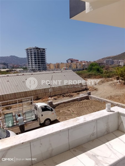 Двухкомнатная квартира, 50м², в доме городского типа на стадии строительства в районе Газипаша, Алания-id-1870-фото-15