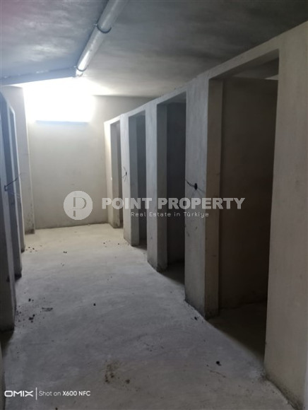 Двухкомнатная квартира, 50м², в доме городского типа на стадии строительства в районе Газипаша, Алания-id-1870-фото-19