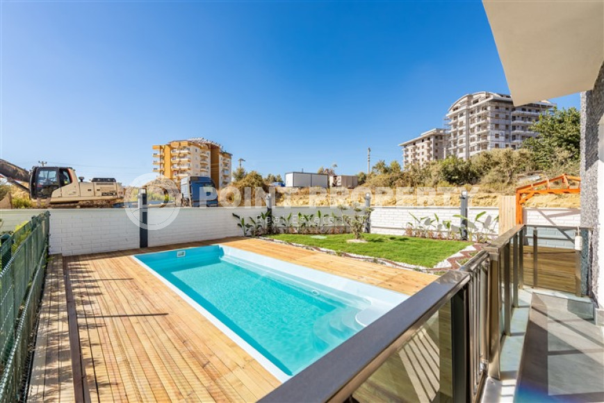 Don't miss the chance: large apartment 1+1, 64m², with access to the garden, in a new complex in Avsallar, Alanya-id-1890-photo-2